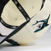 SAN JOSE SHARKS JEFF MCMILLAN ARTIST SERIES OFF WHITE NEW ERA FITTED CAP