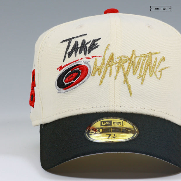 CAROLINA HURRICANES NHL TAKE WARNING OFF WHITE GITD NEW ERA FITTED CAP